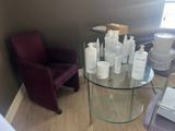 a glass table with several bottles of lotion on it