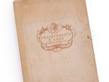 an old book with a picture on it on a white surface