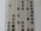 a lot of coins in a plastic bag on a table