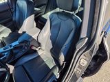 the interior of a car with two seats and a steering wheel