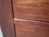 a close up of a wooden door with a handle on it