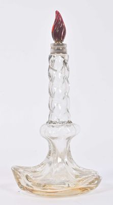an image of a glass candle holder with a red flame on it