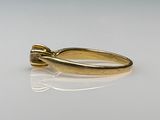 an image of a gold ring with a diamond on it