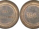 a close up of two old coins with the names of different countries on them