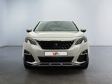 the front view of a white car in a white room