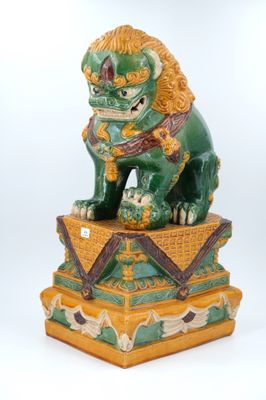 an image of a statue of a lion sitting on top of a box