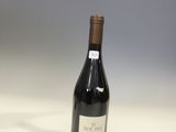 a bottle of wine that is sitting on a table