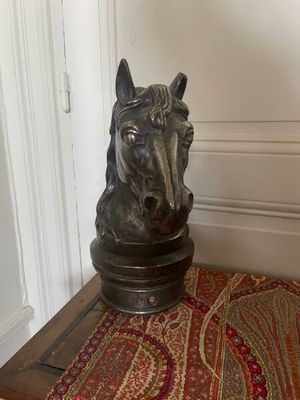 a statue of a horse on a table in a room
