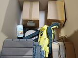 a box with a lot of boxes and a glue gun