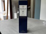 a bottle of macallan on a table in a room