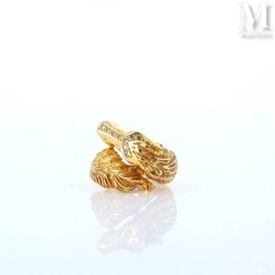 two gold rings on a white surface with a white background