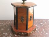 a small wooden box sitting on a marble table