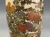 an image of a vase with flowers and birds painted on it