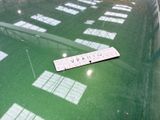 a picture of a parking sign on a green car