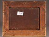an old wooden picture frame with a label on it