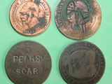 three different coins are shown on a green surface with a green background