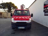 a picture of a red truck parked in a parking lot