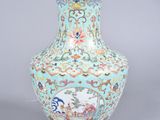 a blue vase with a design on it on a gray surface