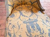 a chaise lounger with a blue and white design on it