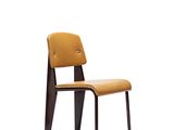 the chair is made of wood and has a brown seat