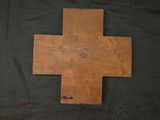 an old wooden cross on a black background