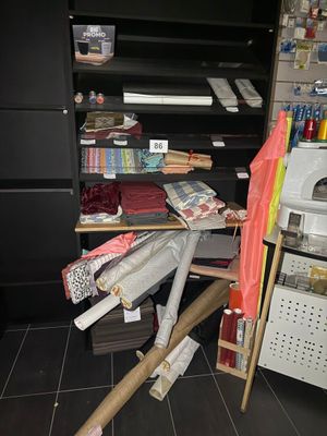 a pile of clothes on a desk in a room