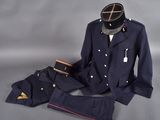 an image of a uniform of a military officer on a grey background