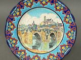 a plate with a picture of a bridge on it