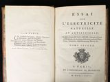 an open book with a picture of a coat of arms on it