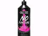 a bottle of pink liquid on a white background