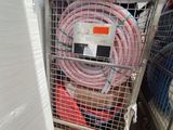 a cart that has a bunch of hoses in it