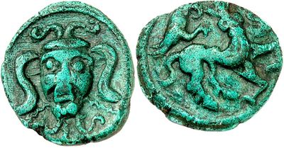 a green coin with a monkey on it and a lion on it