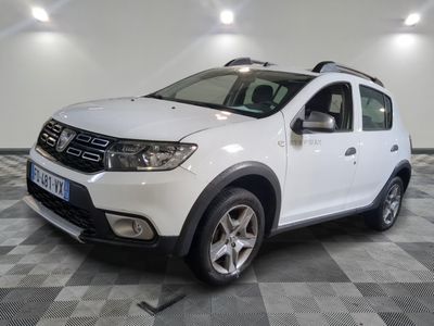 a picture of a white dacia parked in a garage