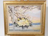 a painting of flowers in a vase on a easel