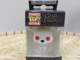 a close up of a box with a toy on a table