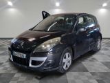 a picture of a small black car parked in a garage