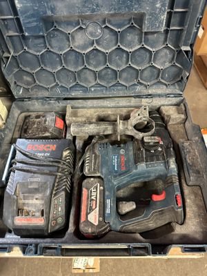 an image of a tool box with a hammer, drill and other tools