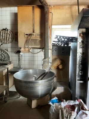 a large metal bowl sitting in the middle of a kitchen