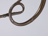 a close up of a metal object on a white surface