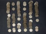 a lot of coins that are on the table