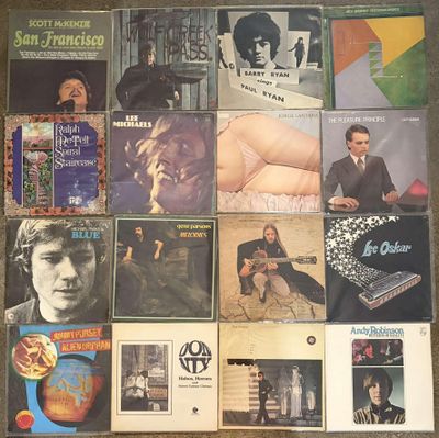 a collage of various album covers on the floor