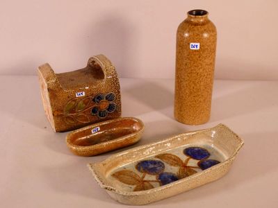 three vases and a dish on the table