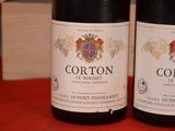 two bottles of wine that are sitting on a table