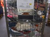 a metal cage with a sign on top of it in a warehouse