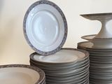 many plates stacked on top of each other on a table