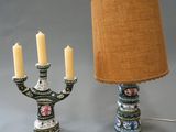 a lamp that is next to a candelier with candles on it