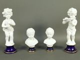 three figurines of a boy with a flute, a boy with a flute, and a boy with a flute