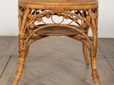 an image of a wicker table on a wooden floor