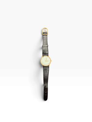 a gold watch with a black leather strap on a white background