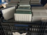 many coolers that are stacked on a cart